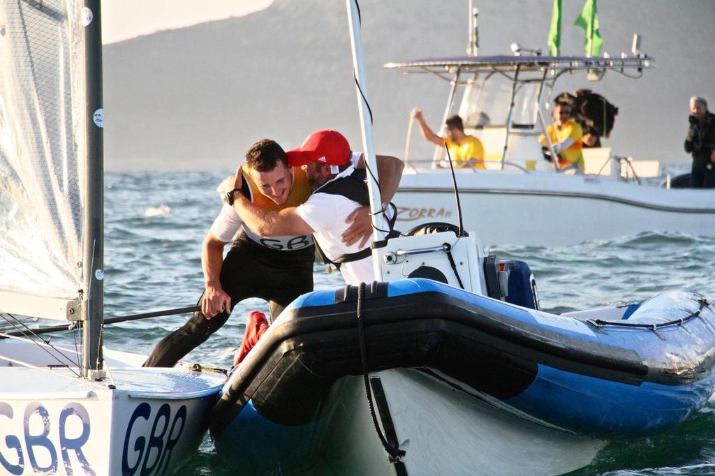 Day 7 - Finn August 14, 2016. Giles Scott celebrates his Gold Medal win in the Finn class with his coach. © Richard Gladwell www.photosport.co.nz